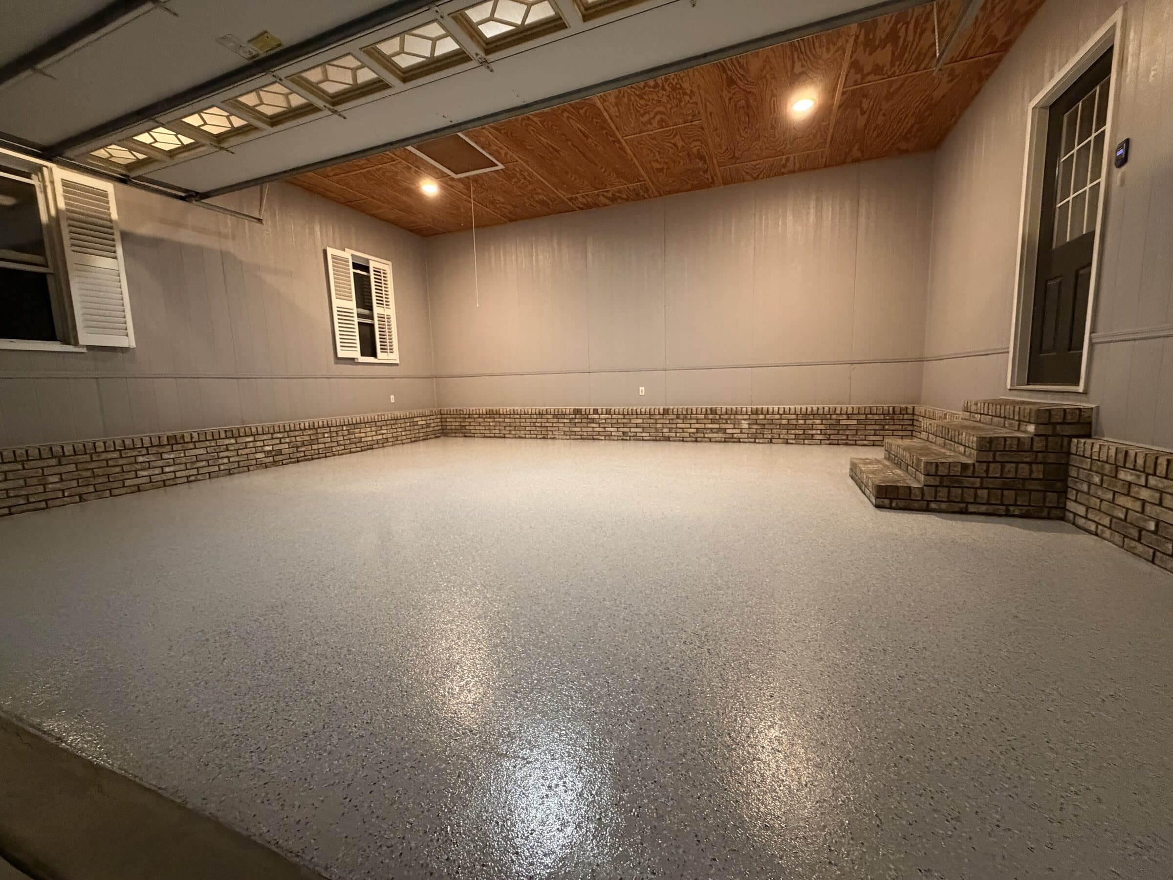 Finished two-car garage floor with gray Tidal Wave flake coating