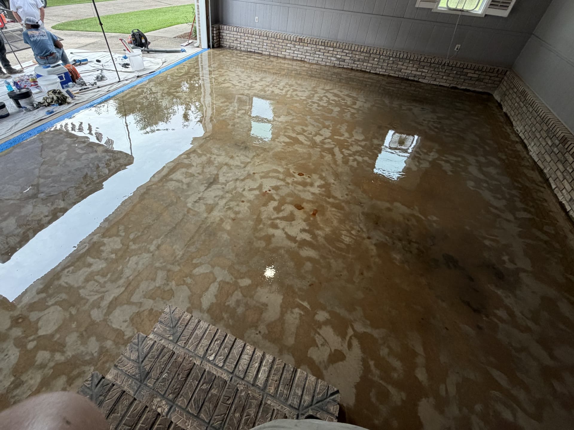 A garage floor during the Summit Surface coating process