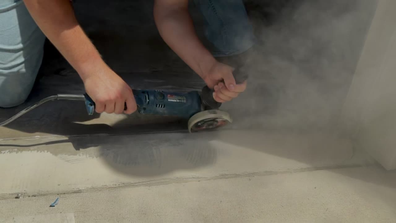 Summit Surface mechanically grinding concrete before coating